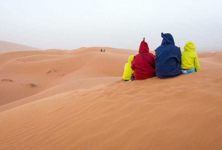 family-with-two-kids-enjoying-beautiful-desert-landscape-in-merzhouga-.jpg