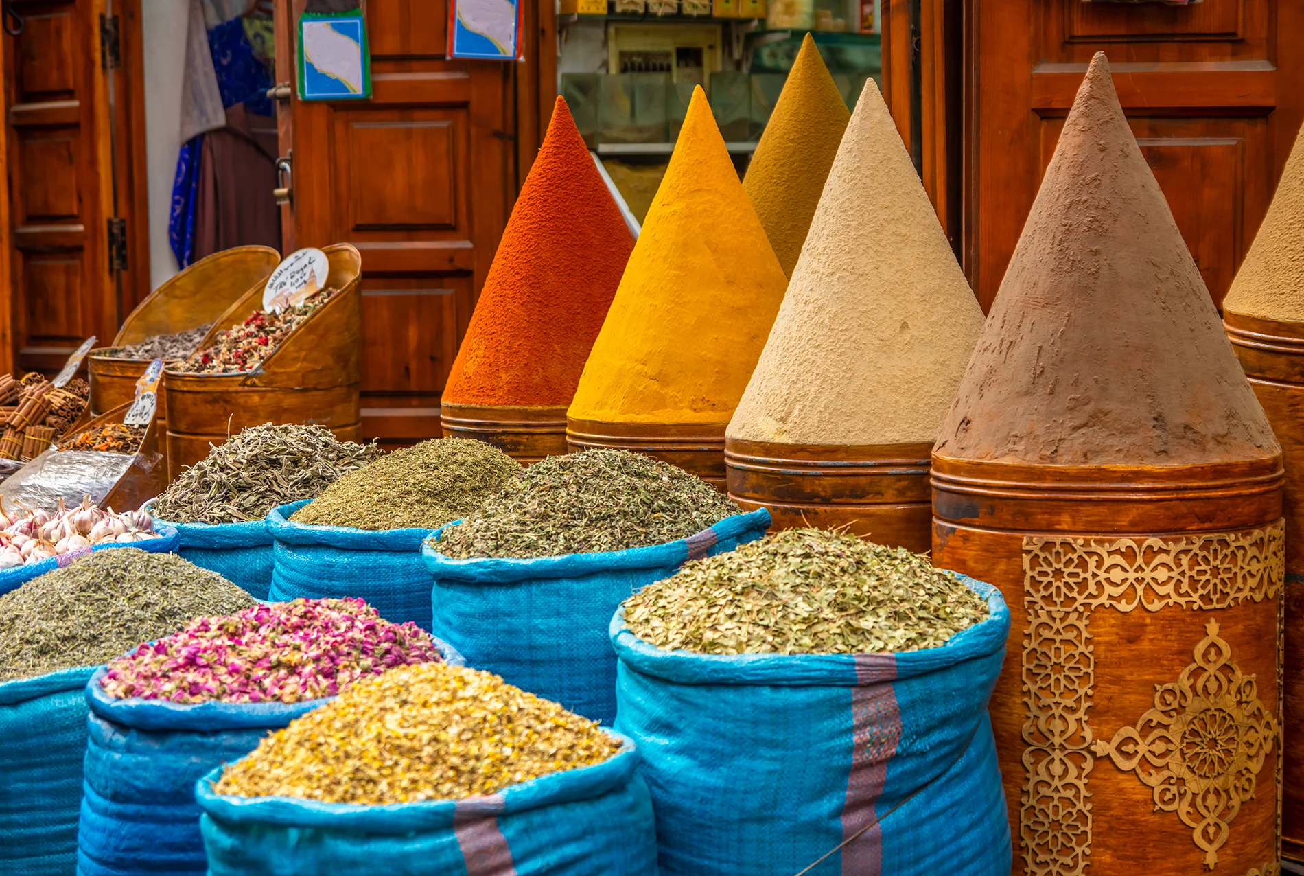 Busy Moroccan souk with tourists and vendors offering services – stay vigilant to avoid scams in Morocco