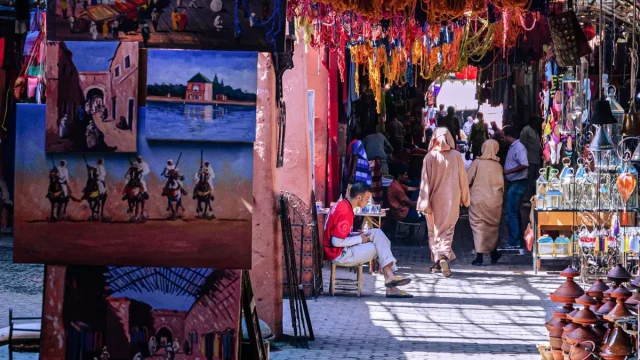 Travelers exploring a Moroccan medina with a certified guide