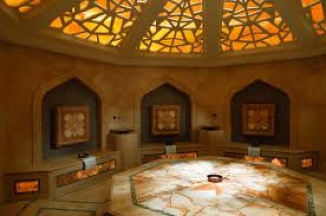 Steam room inside a traditional Moroccan hammam with tiled walls